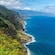 A coastal landscape featuring cliffs covered in greenery on the island of Madeira in Portugal